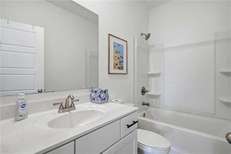 3158 Webb Road Milton, GA 30004 - Photo 15 of 36 a bathroom with a sink toilet and a bathtub