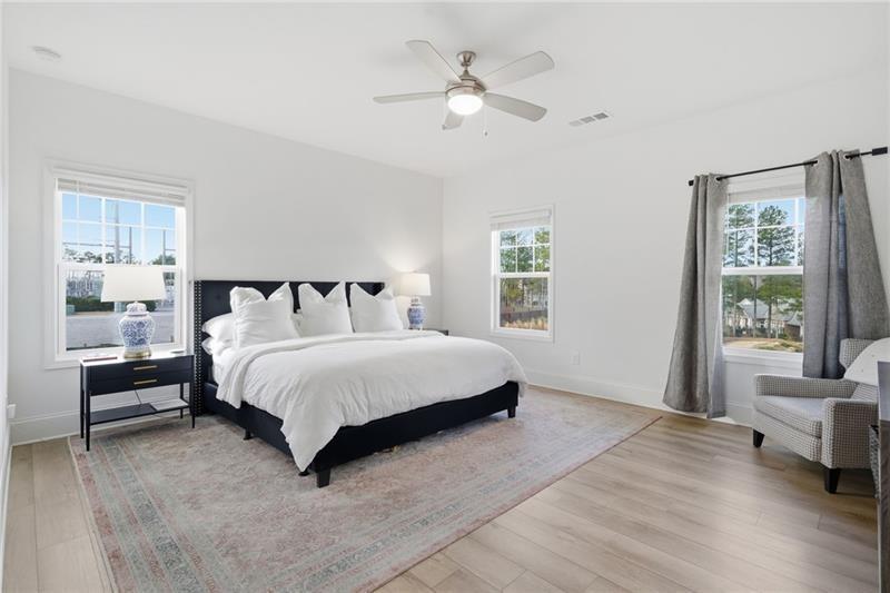 3158 Webb Road Milton, GA 30004 - Photo 17 of 36 a bed sitting in a spacious bedroom next to a window