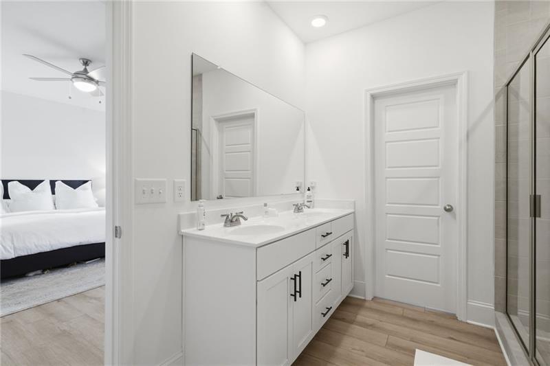 3158 Webb Road Milton, GA 30004 - Photo 20 of 36 a bathroom with a double vanity sink a and mirror