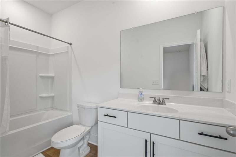 3158 Webb Road Milton, GA 30004 - Photo 24 of 36 a bathroom with a sink toilet vanity tub and shower