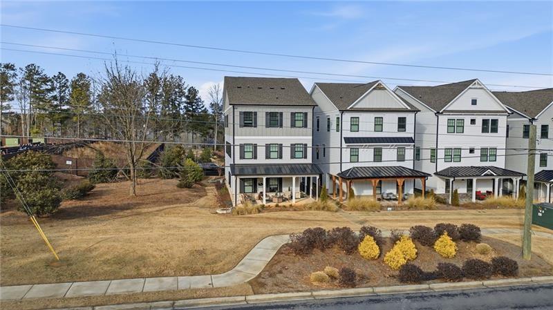 3158 Webb Road Milton, GA 30004 - Photo 26 of 36 a front view of a house with swimming pool and sitting area