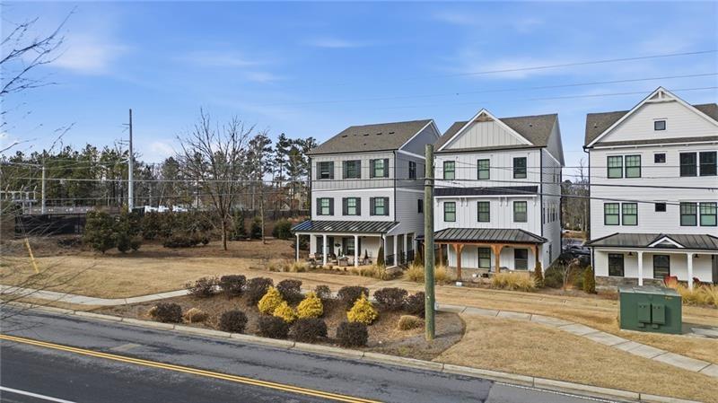 3158 Webb Road Milton, GA 30004 - Photo 27 of 36 a front view of a residential apartment building with a yard