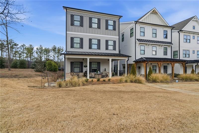 3158 Webb Road Milton, GA 30004 - Photo 3 of 36 a front view of a residential apartment building with a yard