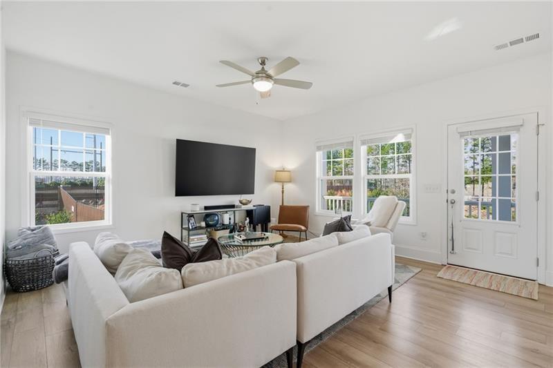 3158 Webb Road Milton, GA 30004 - Photo 5 of 36 a living room with furniture and a flat screen tv