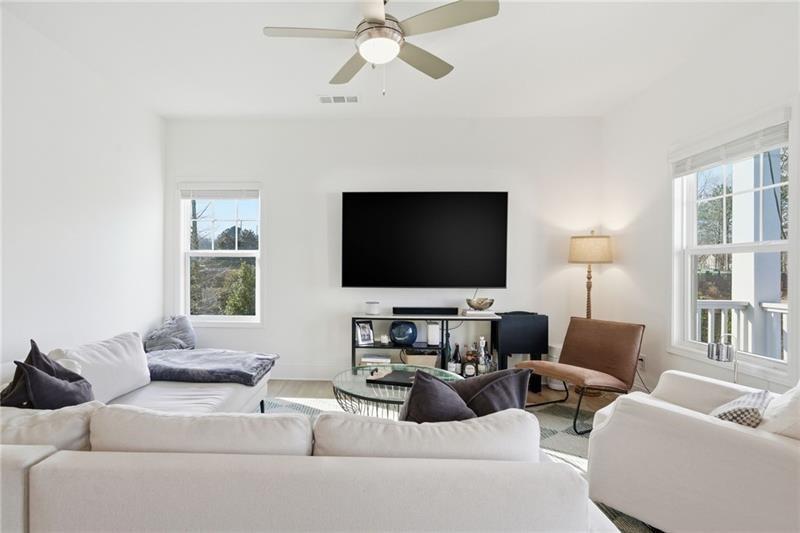 3158 Webb Road Milton, GA 30004 - Photo 6 of 36 a living room with furniture and a flat screen tv