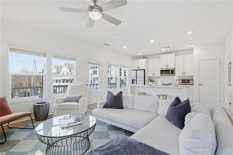 3158 Webb Road Milton, GA 30004 - Photo 8 of 36 a living room with furniture and a view of kitchen