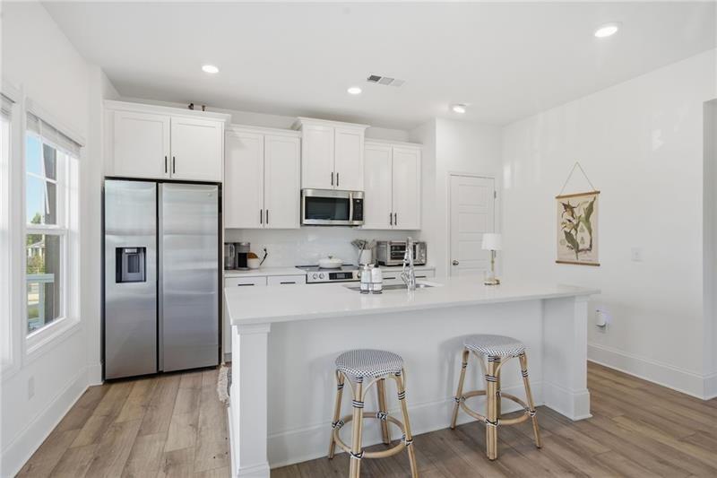 3158 Webb Road Milton, GA 30004 - Photo 10 of 36 a kitchen with stainless steel appliances a refrigerator sink and microwave