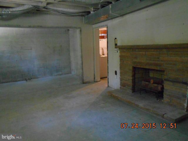 4112 Belt Road Capitol Heights, MD 20743 - Photo 12 of 13 view of empty room with a fireplace