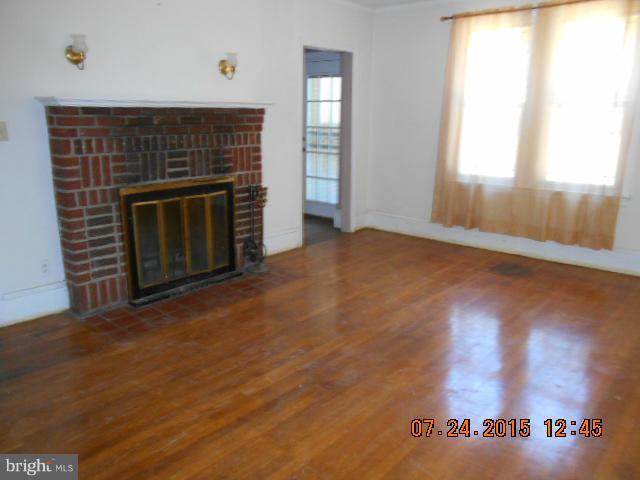 4112 Belt Road Capitol Heights, MD 20743 - Photo 3 of 13 a view of empty room with window and fireplace