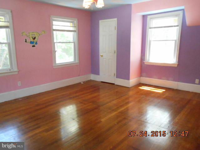 4112 Belt Road Capitol Heights, MD 20743 - Photo 8 of 13 a view of livingroom with hardwood floor and window
