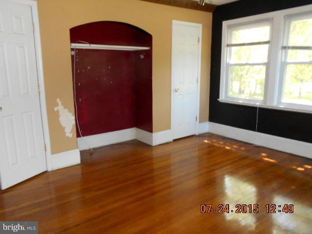 4112 Belt Road Capitol Heights, MD 20743 - Photo 10 of 13 a view of empty room with window and wooden floor
