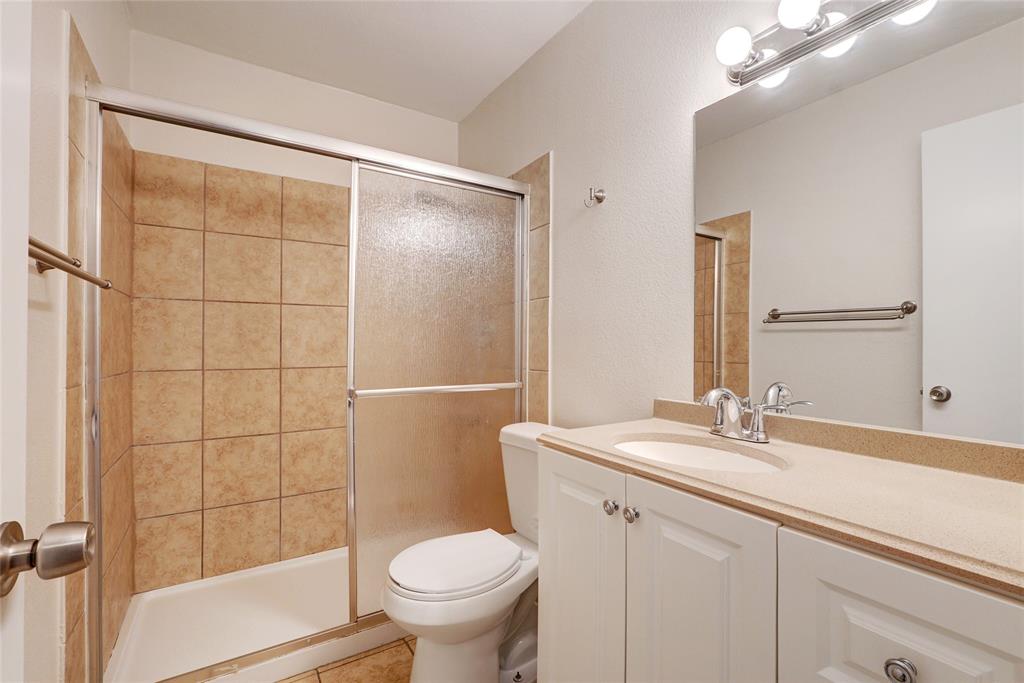 1010 West 23rd Street, Unit 1 Austin, TX 78705 - Photo 8 of 10 a bathroom with a sink toilet and shower