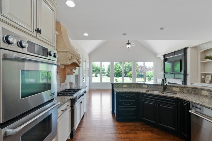 3624 Lime Valley Bridge Road Thompson's Station, TN 37179 - Photo 29 of 69 a kitchen with stainless steel appliances sink stove and cabinets