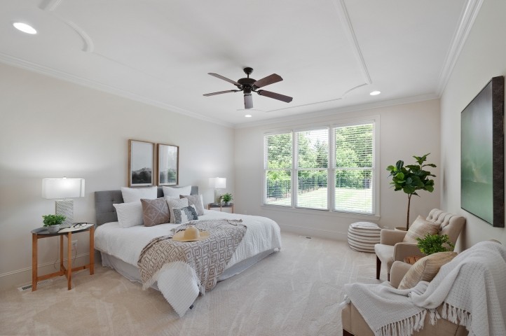 3624 Lime Valley Bridge Road Thompson's Station, TN 37179 - Photo 37 of 69 a spacious bedroom with a bed and a chandelier