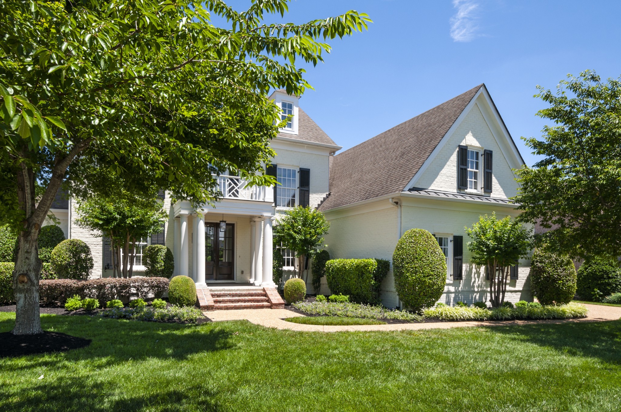 3624 Lime Valley Bridge Road Thompson's Station, TN 37179 - Photo 4 of 69 a front view of a house with a yard and garage