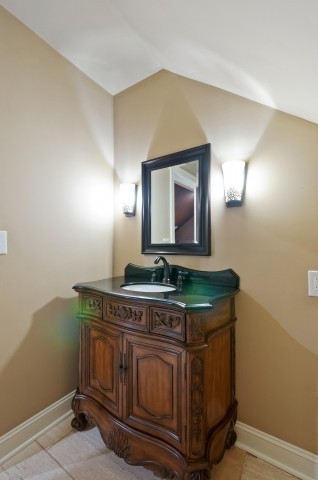 3624 Lime Valley Bridge Road Thompson's Station, TN 37179 - Photo 62 of 69 a bathroom with a sink and a mirror