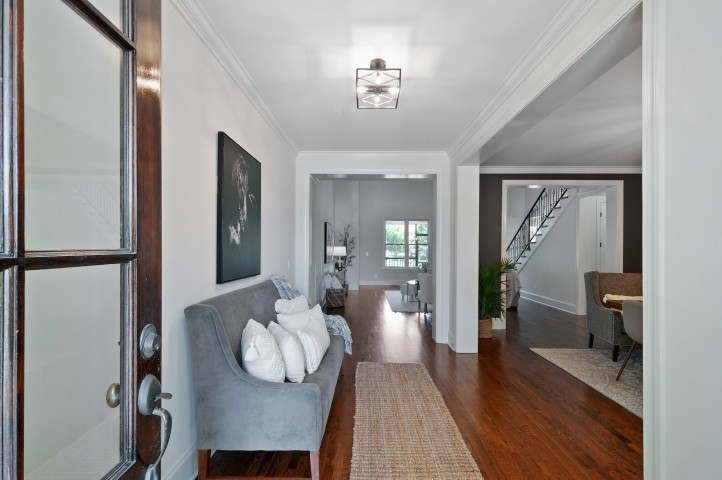3624 Lime Valley Bridge Road Thompson's Station, TN 37179 - Photo 8 of 69 a dining room with furniture wooden floor mirror and a chandelier