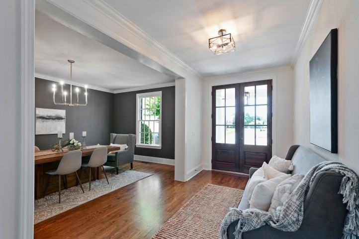 3624 Lime Valley Bridge Road Thompson's Station, TN 37179 - Photo 9 of 69 a living room with furniture and a chandelier