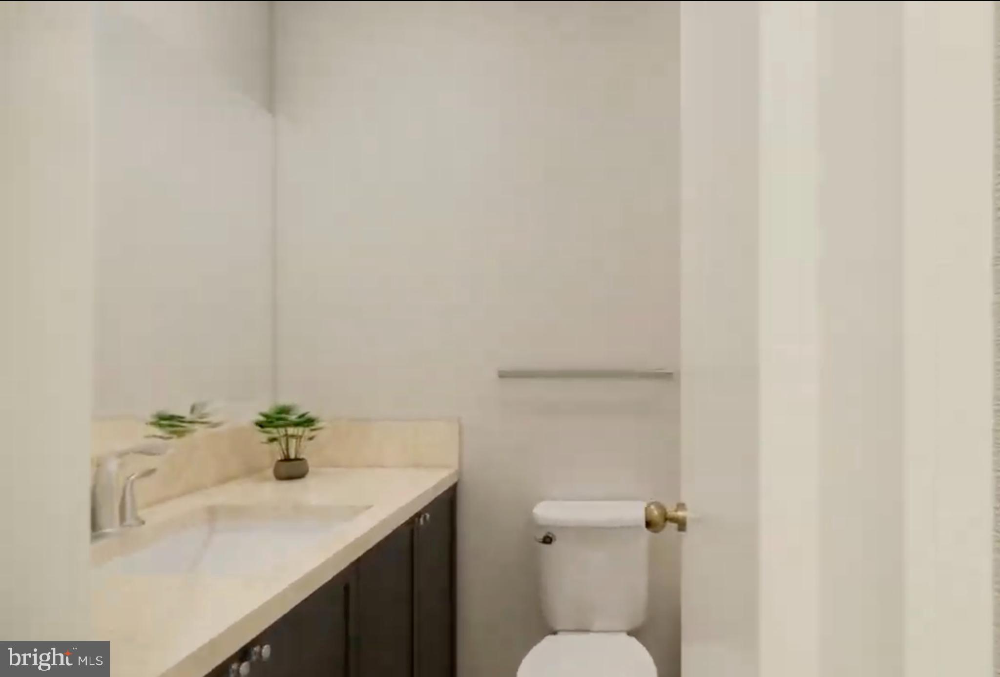 950 25th Street Northwest, Unit 607N Washington, DC 20037 - Photo 15 of 36 a bathroom with a sink and a toilet