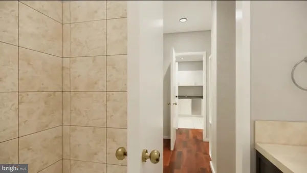 a view of hallway with wooden floor