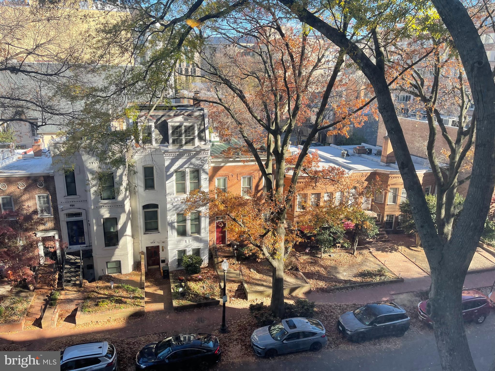 950 25th Street Northwest, Unit 607N Washington, DC 20037 - Photo 17 of 36 a city view with tall buildings and cars