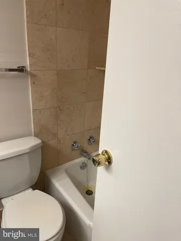 a view of hallway with wooden floor