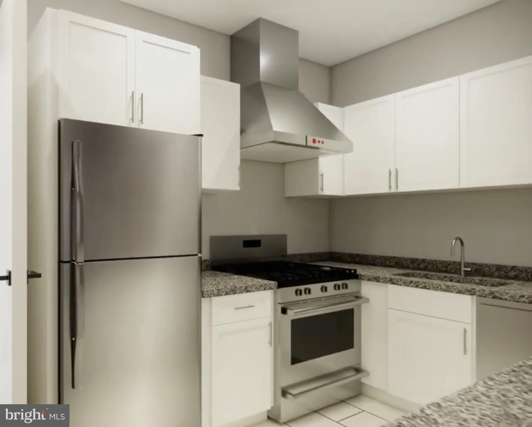 950 25th Street Northwest, Unit 607N Washington, DC 20037 - Photo 5 of 36 a kitchen with a refrigerator and a stove