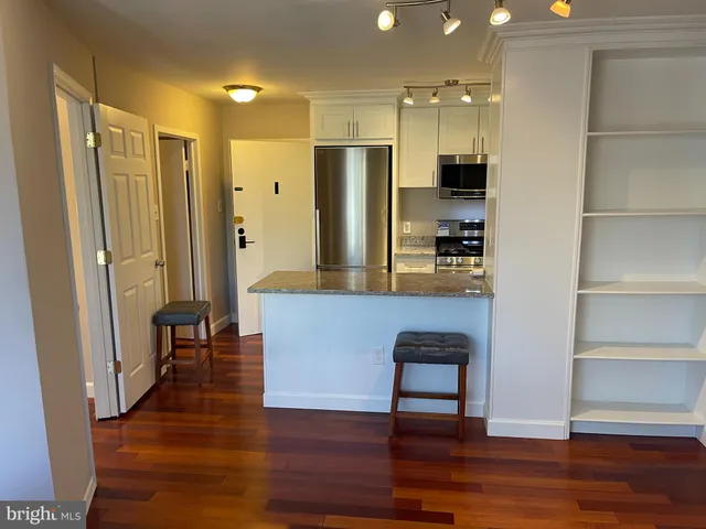 a view of wooden floor in a small room