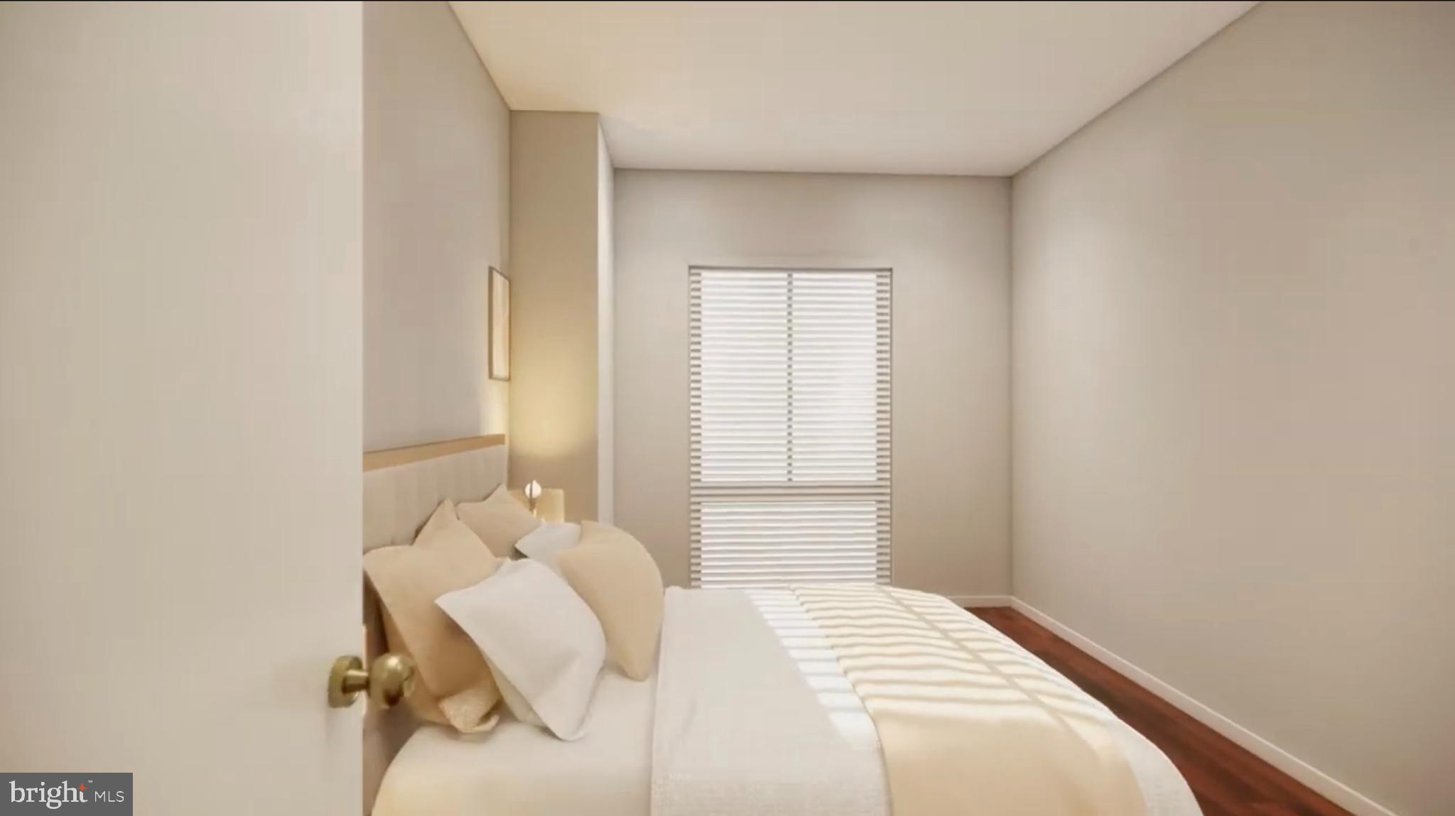 950 25th Street Northwest, Unit 607N Washington, DC 20037 - Photo 8 of 36 a bedroom with a bed and a window