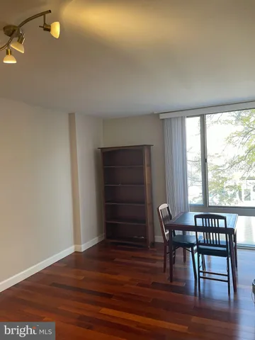 a city view with tall buildings and cars