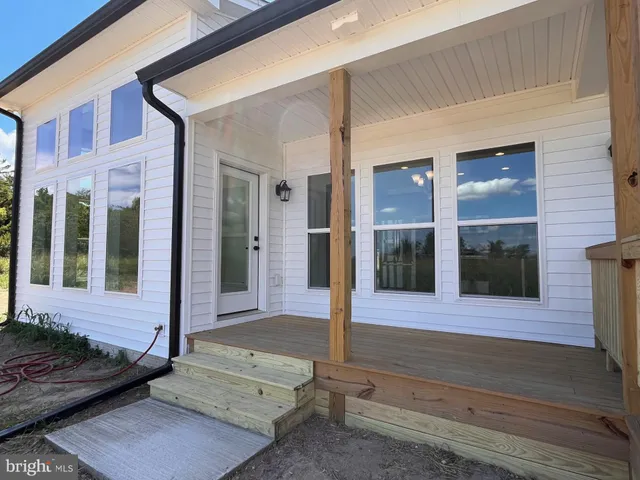 a view of a brick house with a large window