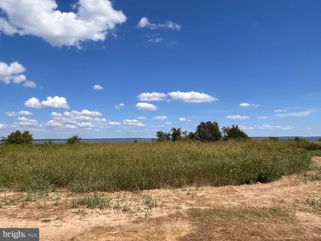 a view of a lake with a house