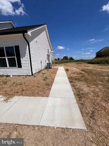 a view of balcony with wooden floor and a ocean view