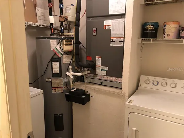 a view of storage and utility room with washer and dryer