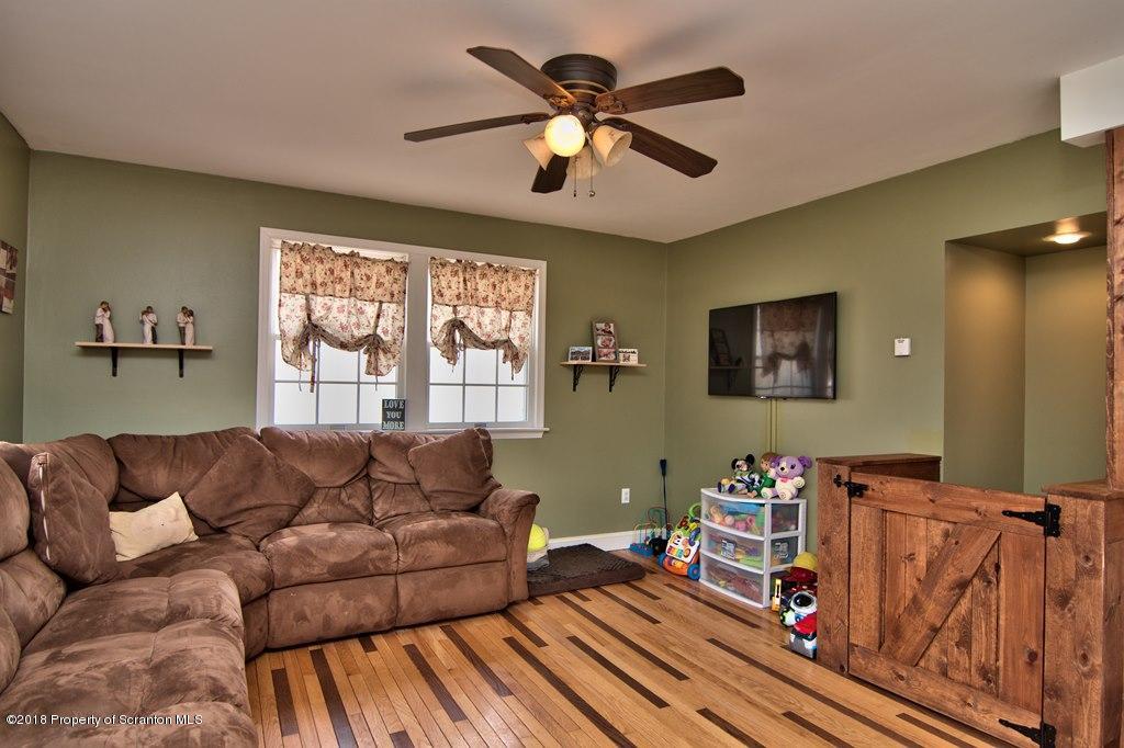 2050 Reservoir Road Moscow, PA 18444 - Photo 24 of 44 a living room with furniture and a window