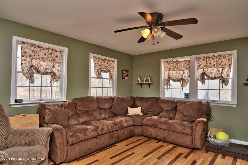 2050 Reservoir Road Moscow, PA 18444 - Photo 25 of 44 a living room with furniture and a large window