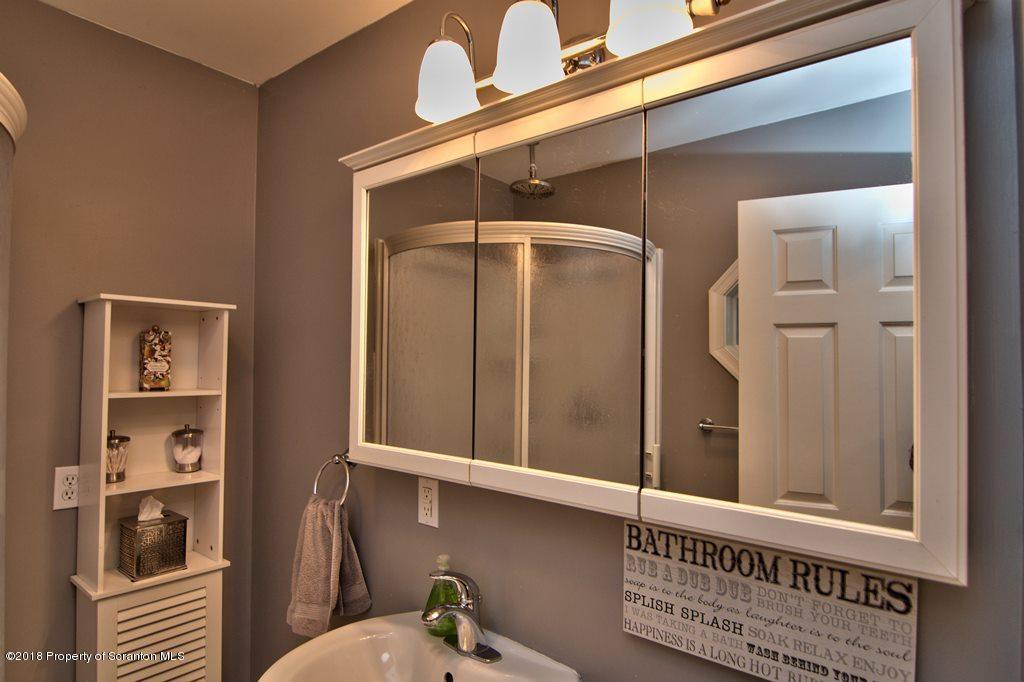 2050 Reservoir Road Moscow, PA 18444 - Photo 26 of 44 a bathroom with a window and a shower
