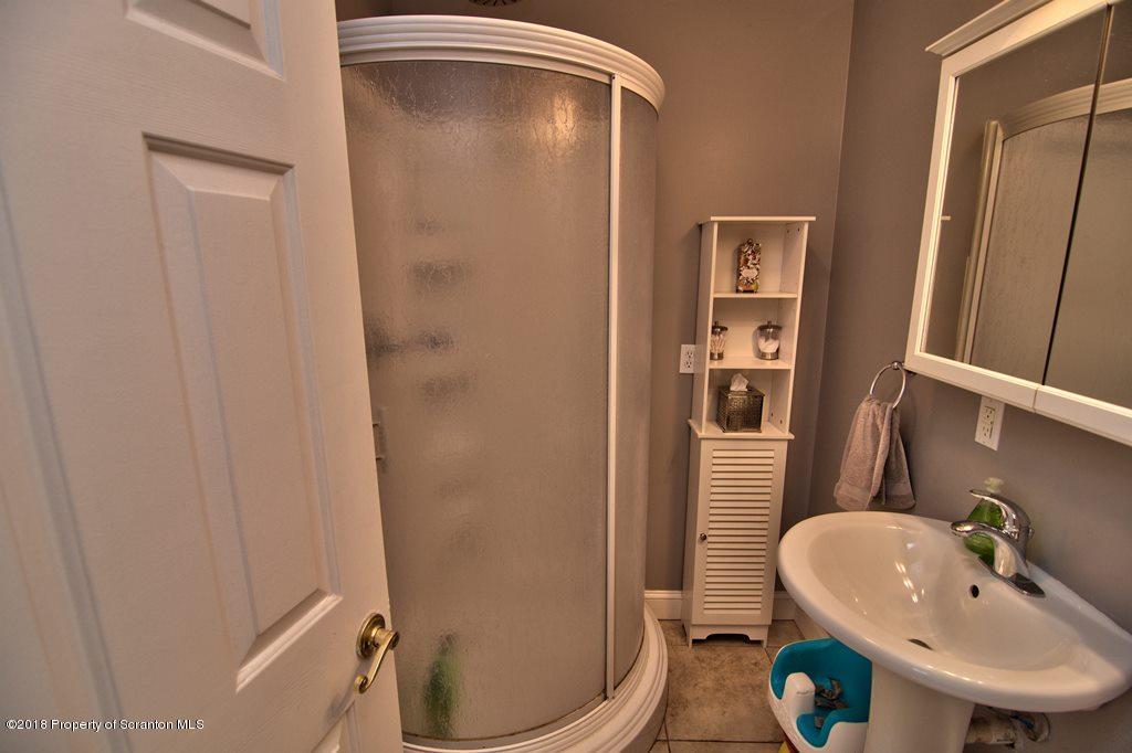 2050 Reservoir Road Moscow, PA 18444 - Photo 28 of 44 a bathroom with a sink and a mirror