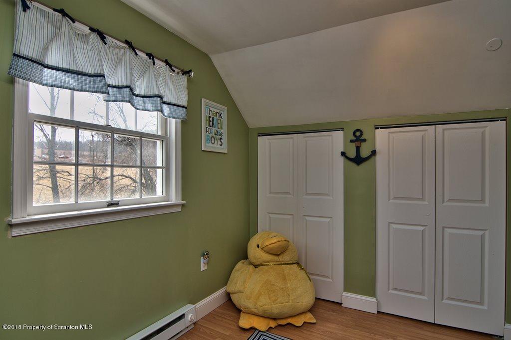 2050 Reservoir Road Moscow, PA 18444 - Photo 33 of 44 a room with wooden door and stairs