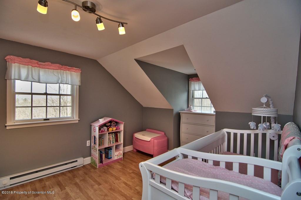 2050 Reservoir Road Moscow, PA 18444 - Photo 34 of 44 a bedroom with furniture and a window
