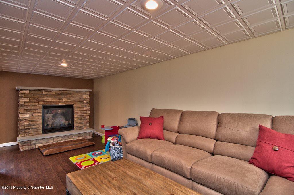 2050 Reservoir Road Moscow, PA 18444 - Photo 42 of 44 a living room with furniture and a fireplace