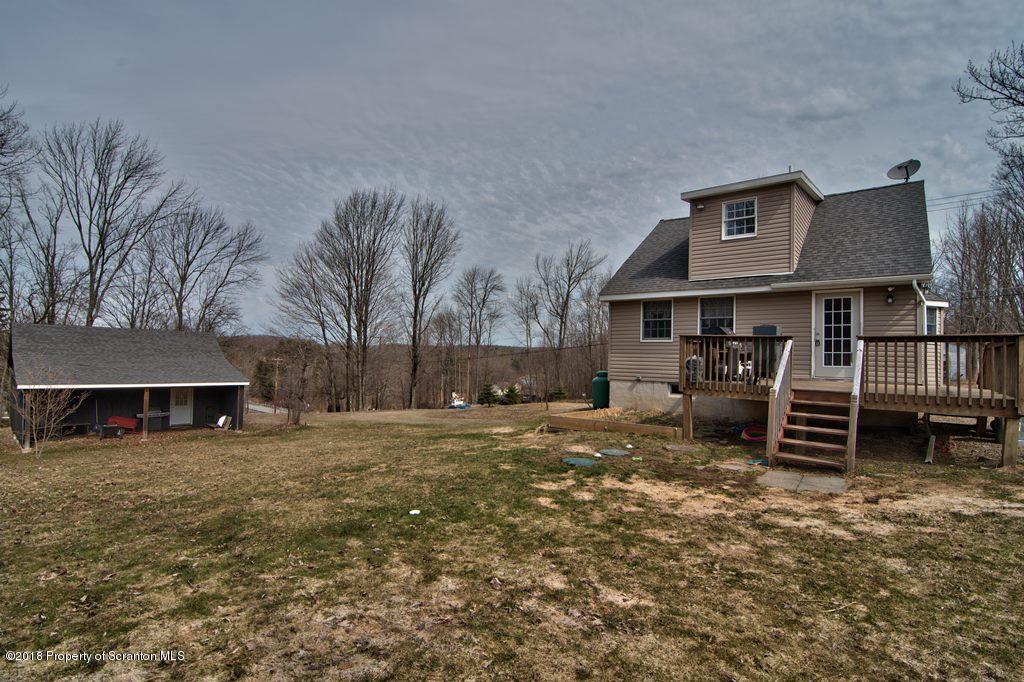 2050 Reservoir Road Moscow, PA 18444 - Photo 7 of 44 a view of a house with a yard and sitting area
