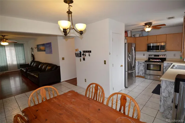 a view of a dining room with furniture window and outside view