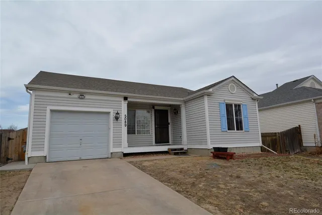 a view of a house with a sink and bench in front of house