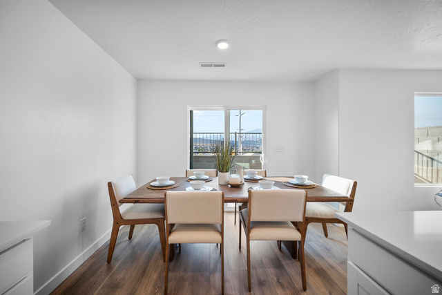 2123 Wolverine Way, Unit 2437 Washington, UT 84780 - Photo 20 of 40 Spacious dining area featuring wood-finish flooring, a sliding glass door, and abundant natural light