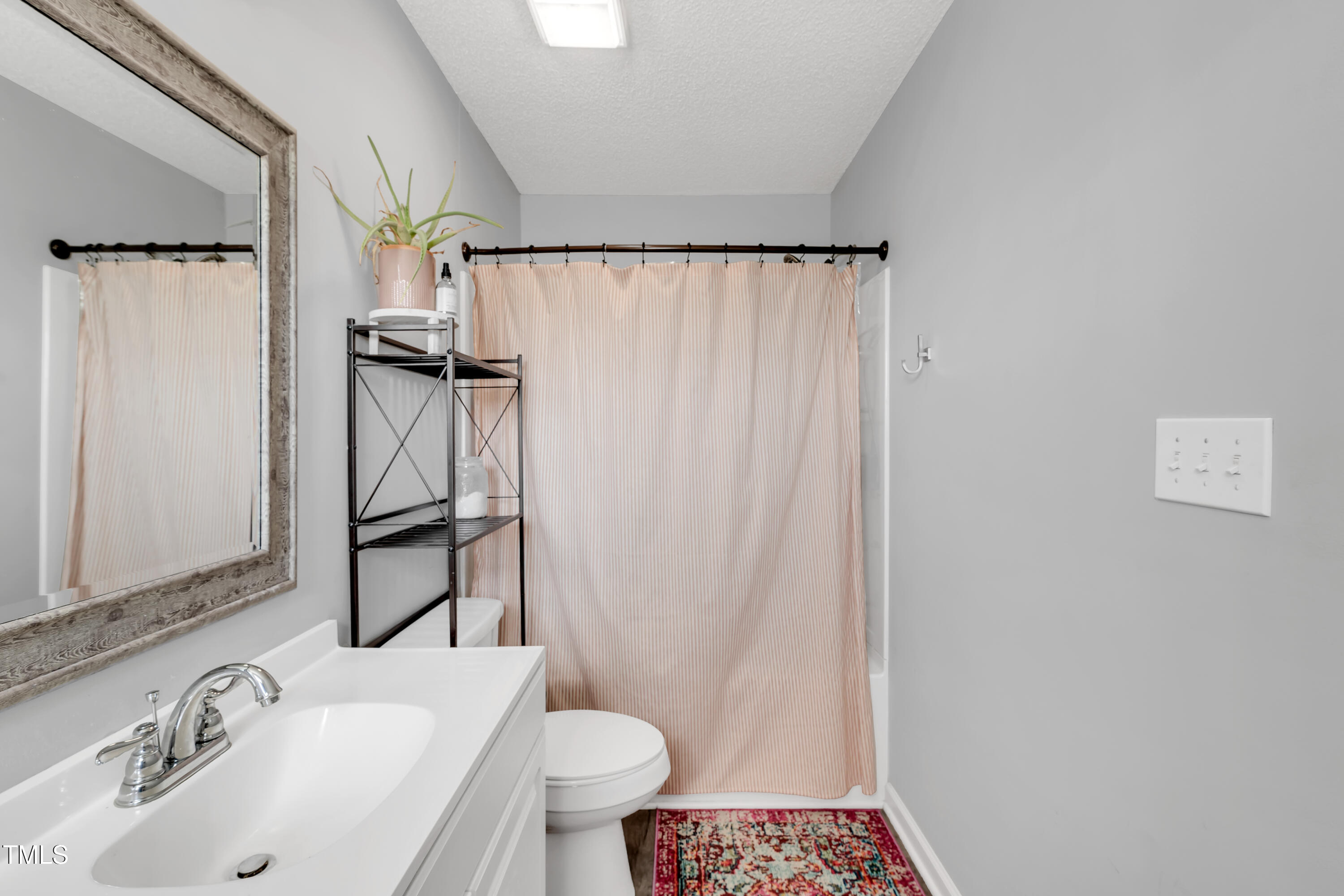 640 Short Journey Road Smithfield, NC 27577 - Photo 12 of 27 a bathroom with a sink toilet and shower