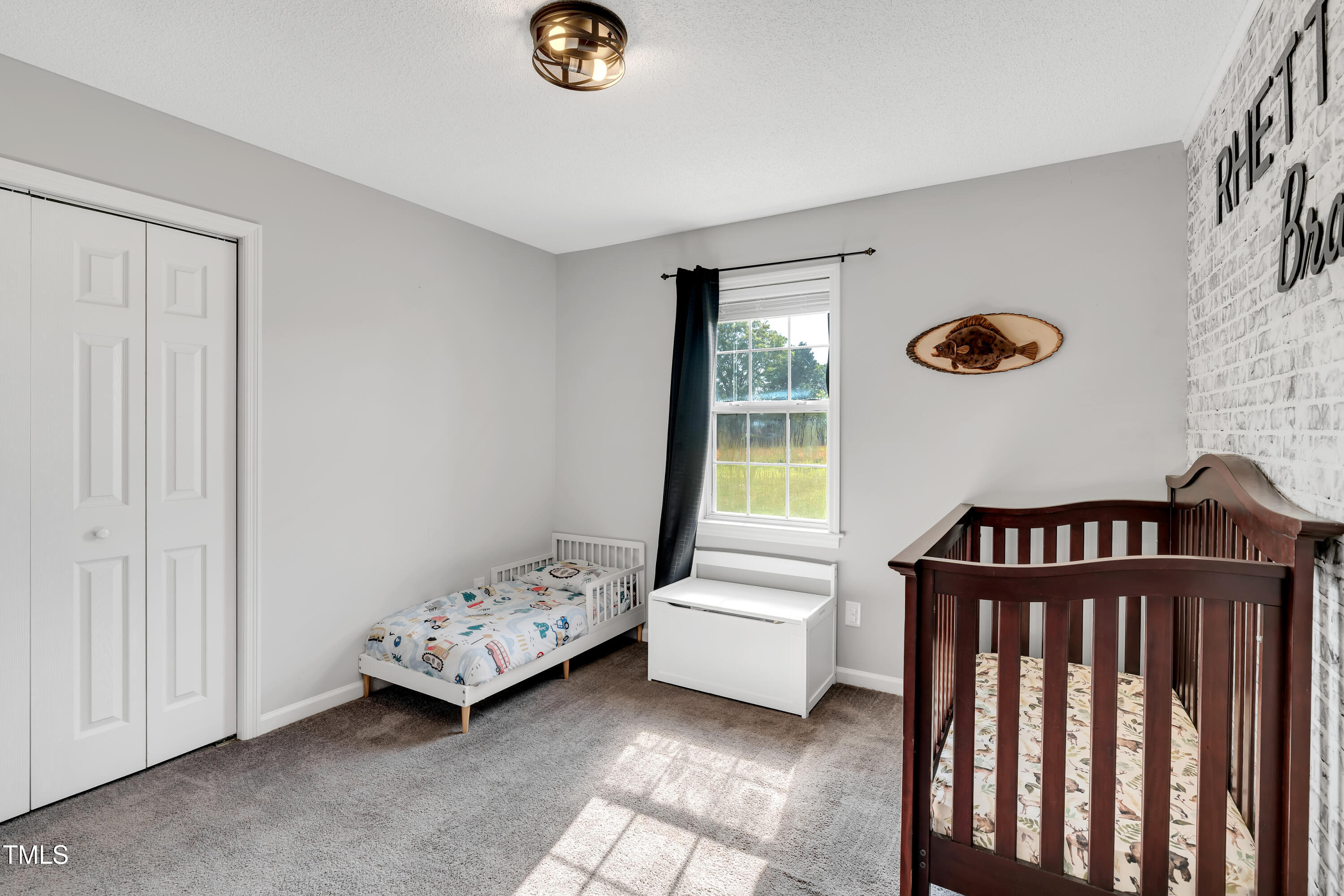 640 Short Journey Road Smithfield, NC 27577 - Photo 14 of 27 a bedroom with furniture and a window