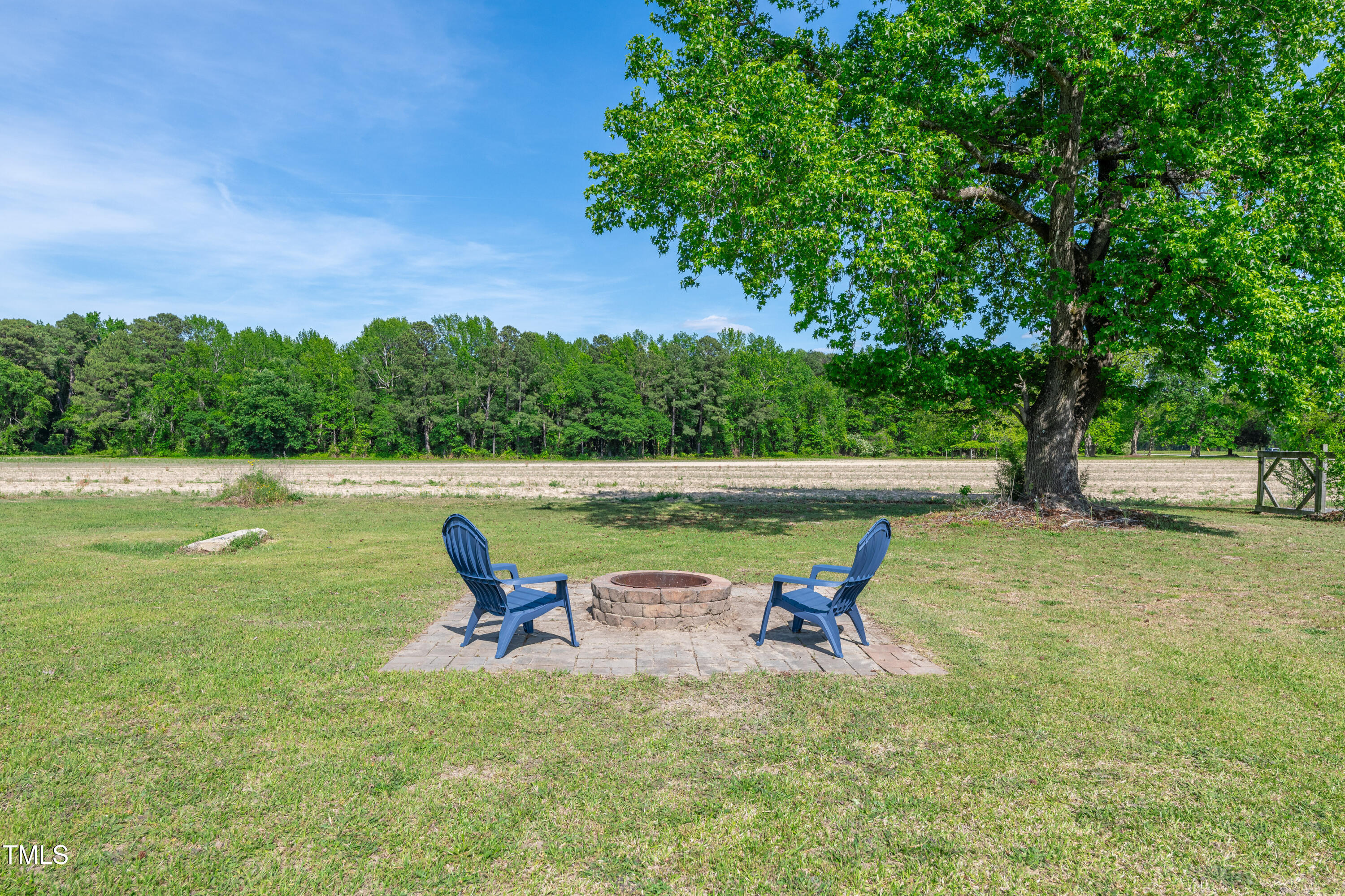 640 Short Journey Road Smithfield, NC 27577 - Photo 19 of 27 a view of a lake with table and chairs