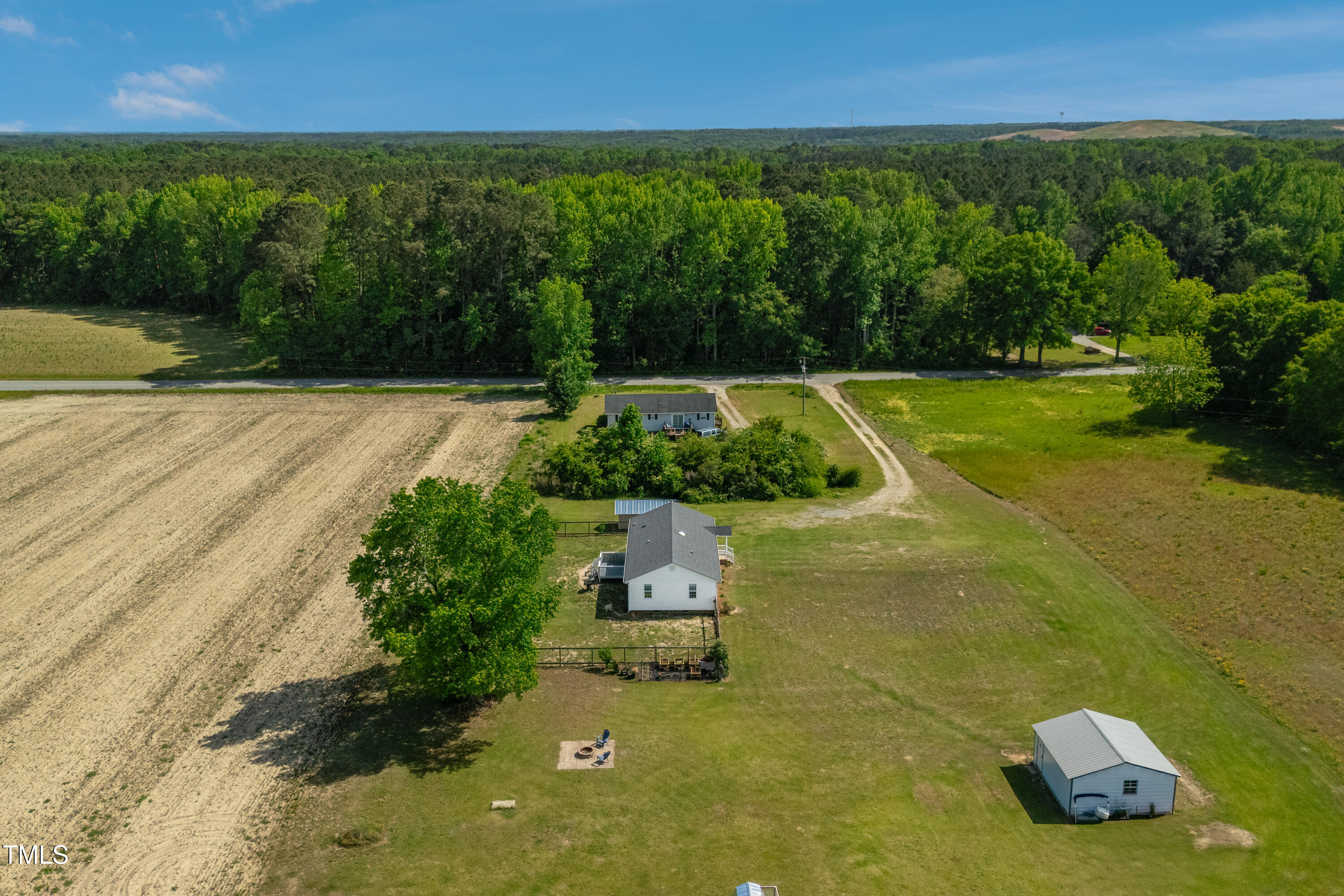 640 Short Journey Road Smithfield, NC 27577 - Photo 22 of 27 a view of a garden with lawn chairs