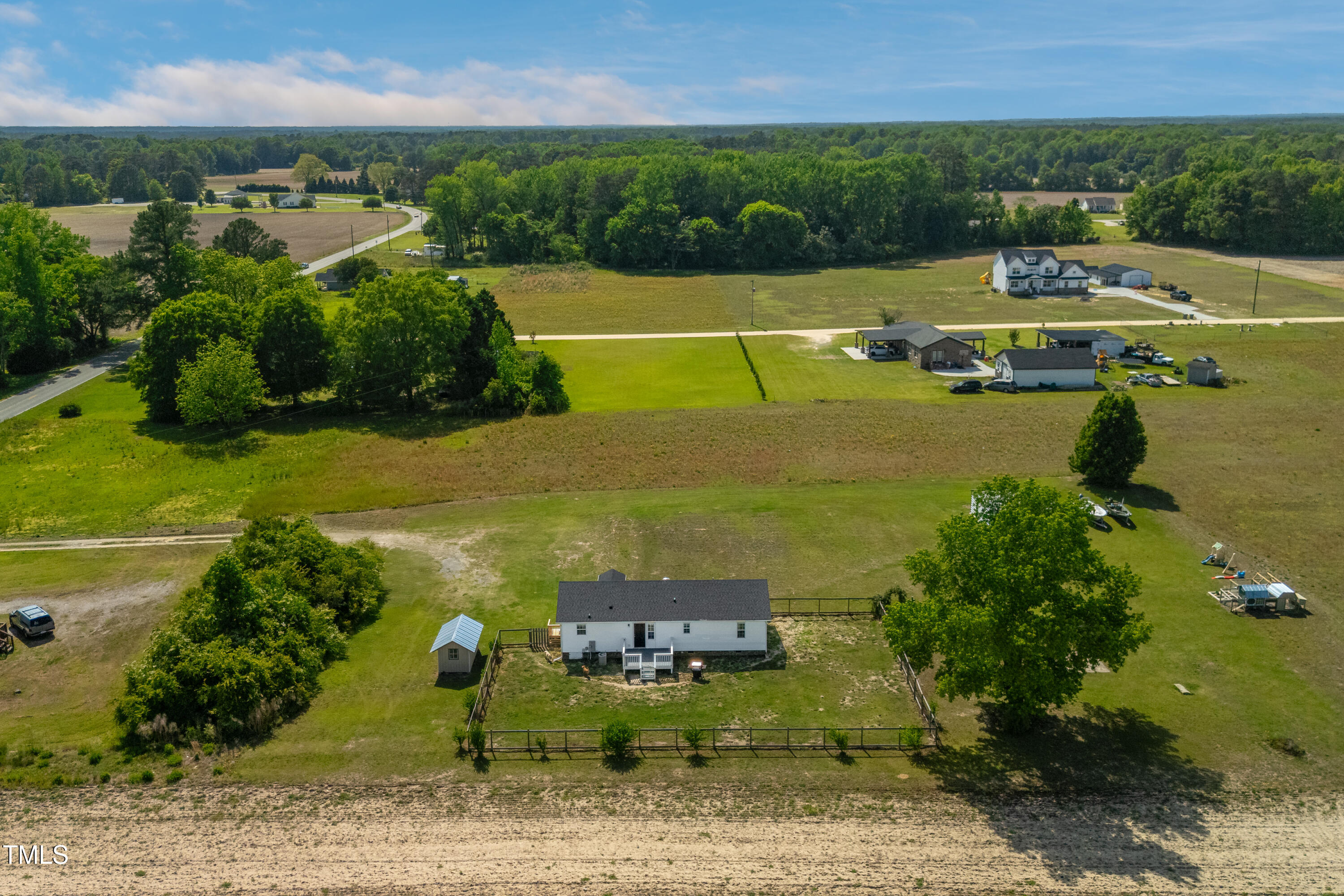 640 Short Journey Road Smithfield, NC 27577 - Photo 24 of 27 a view of a lake with a building in the background